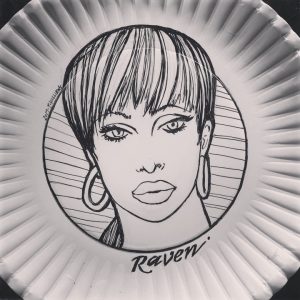 Raven drawn in ink on a paper plate.